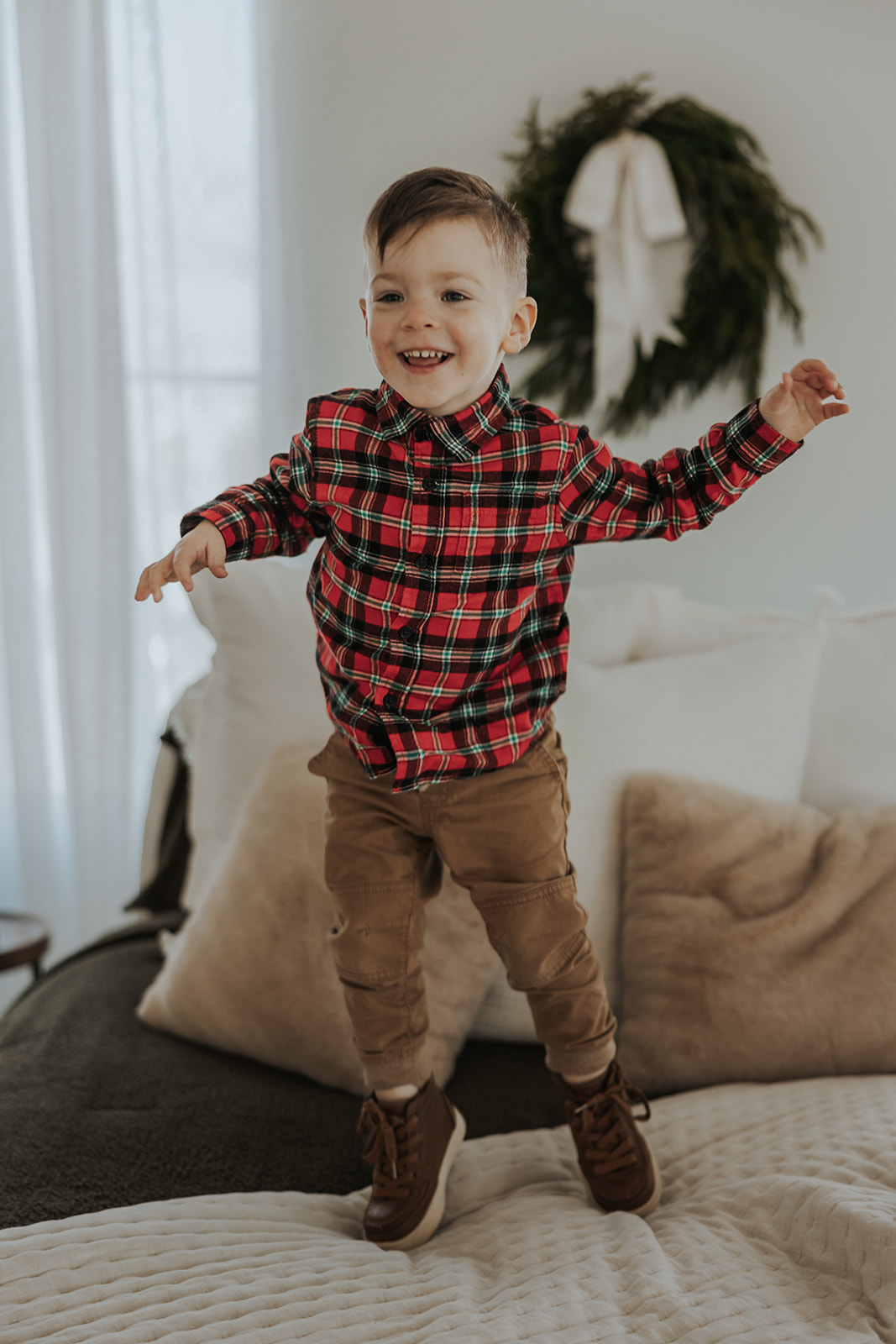 child poses during their families holiday photoshoot