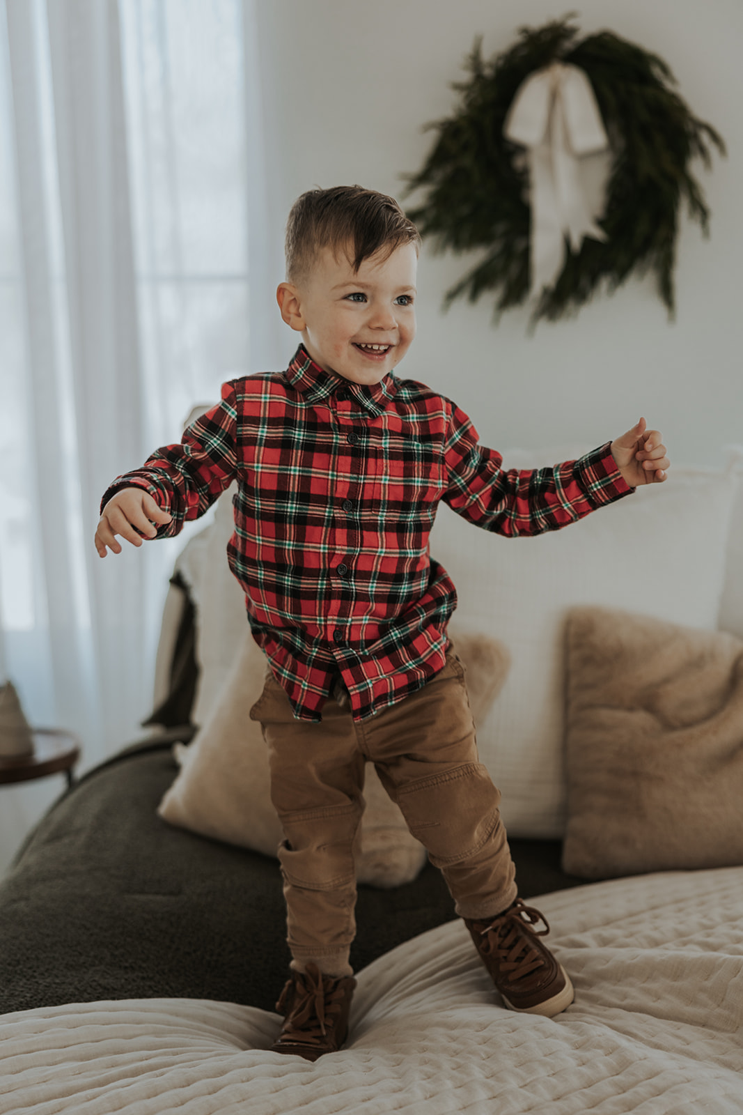 child poses during their families holiday photoshoot