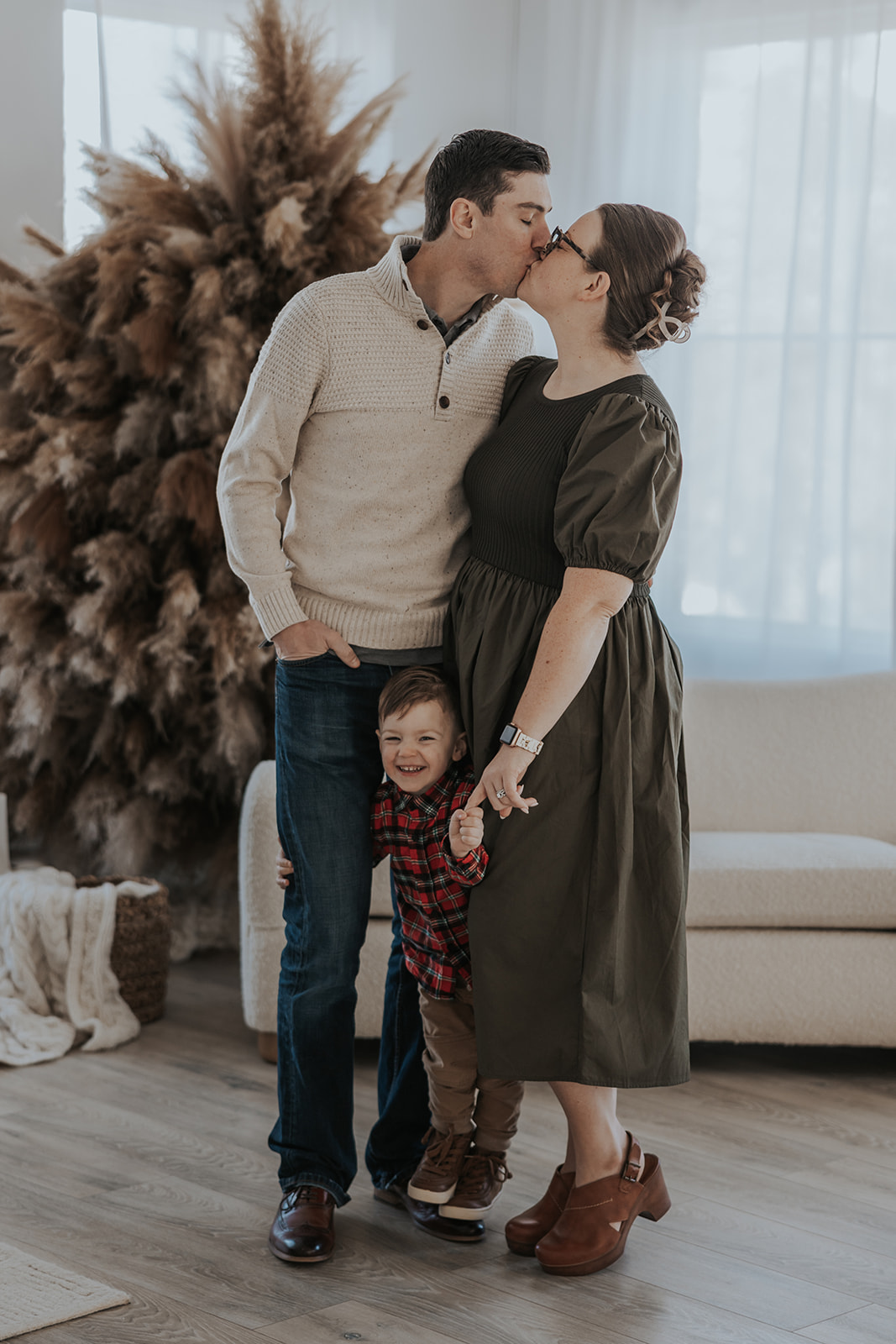 beautiful family pose together during their Family Photos in a Studio