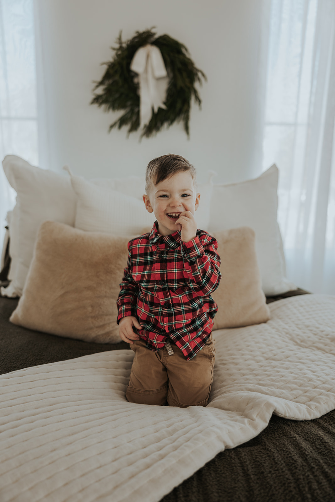 child poses during their Family Photos in a Studio