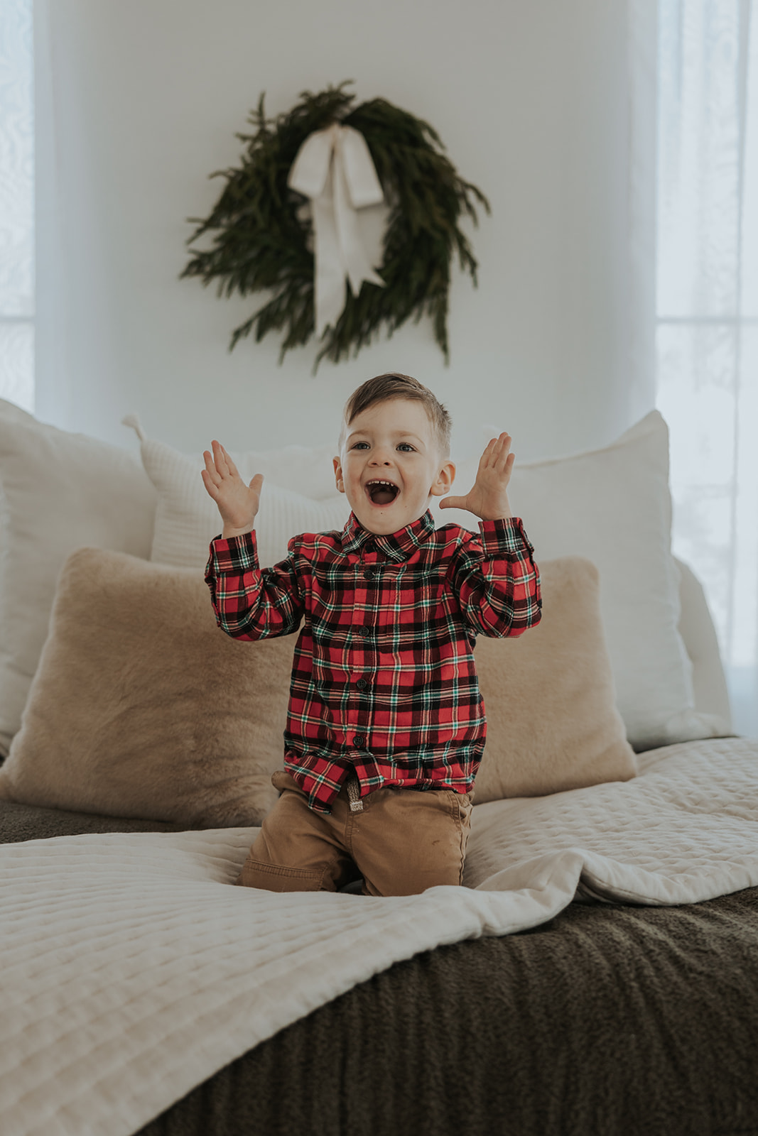 child poses during their Family Photos in a Studio