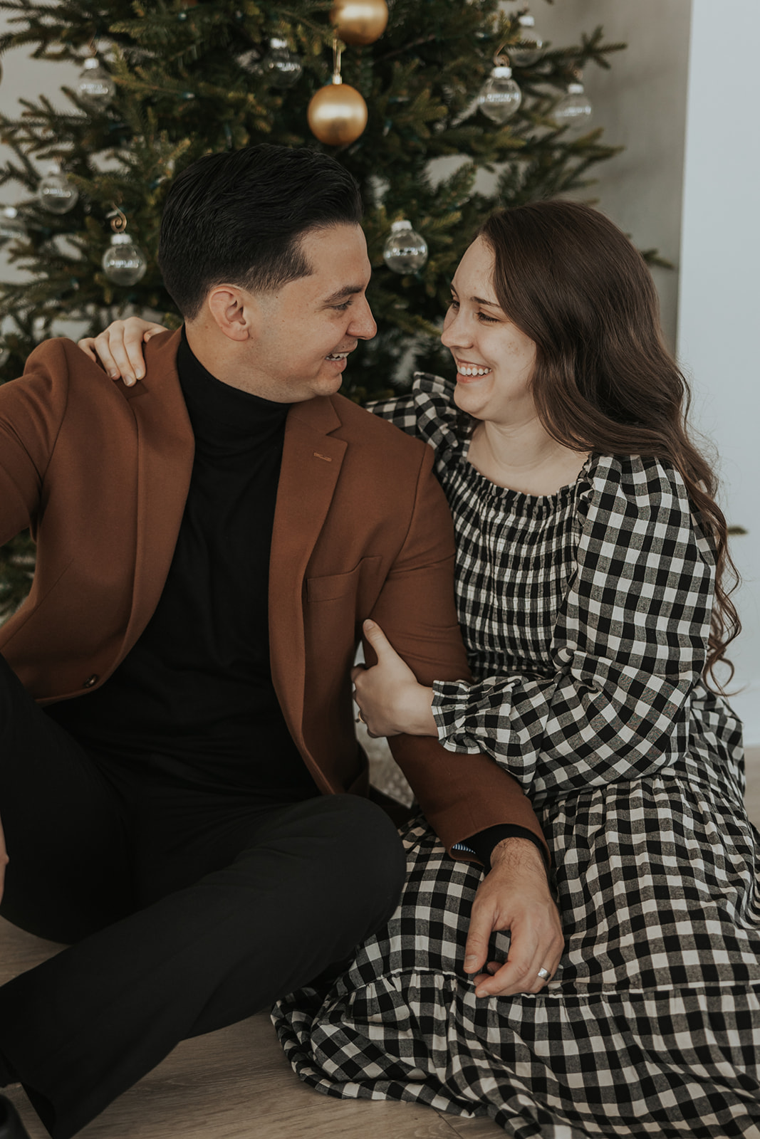 beautiful couple pose together during their in home photoshoot