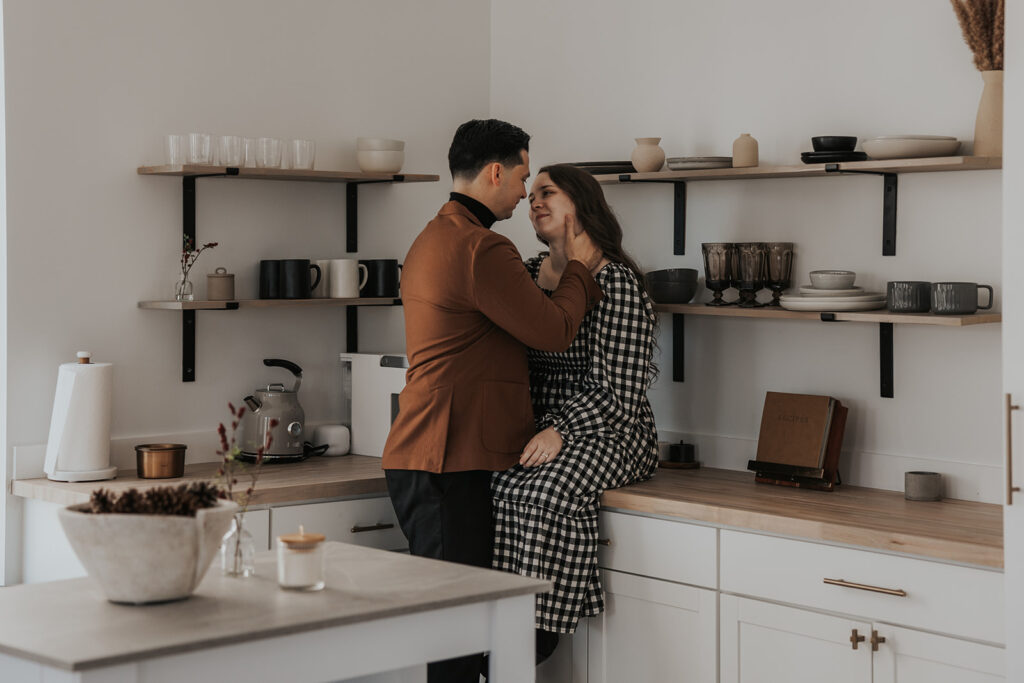 beautiful couple pose together during their in home photoshoot