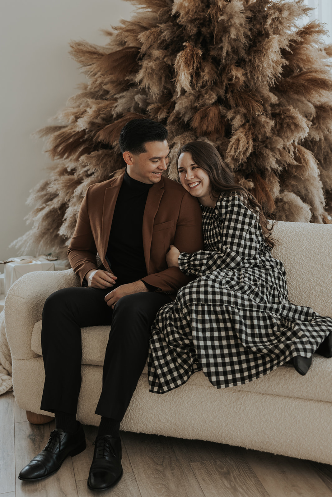 beautiful couple pose together during their in home photoshoot