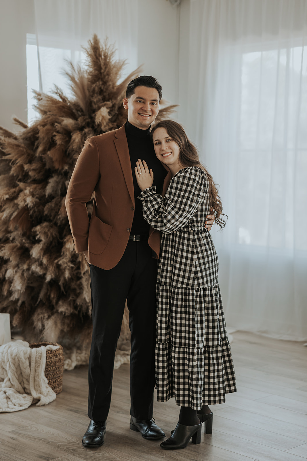 beautiful couple pose together during their in home photoshoot