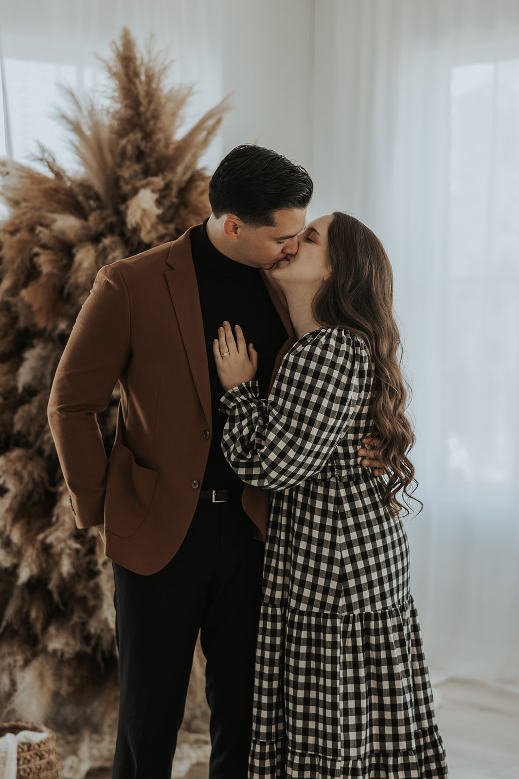 beautiful couple pose together during their in home photoshoot