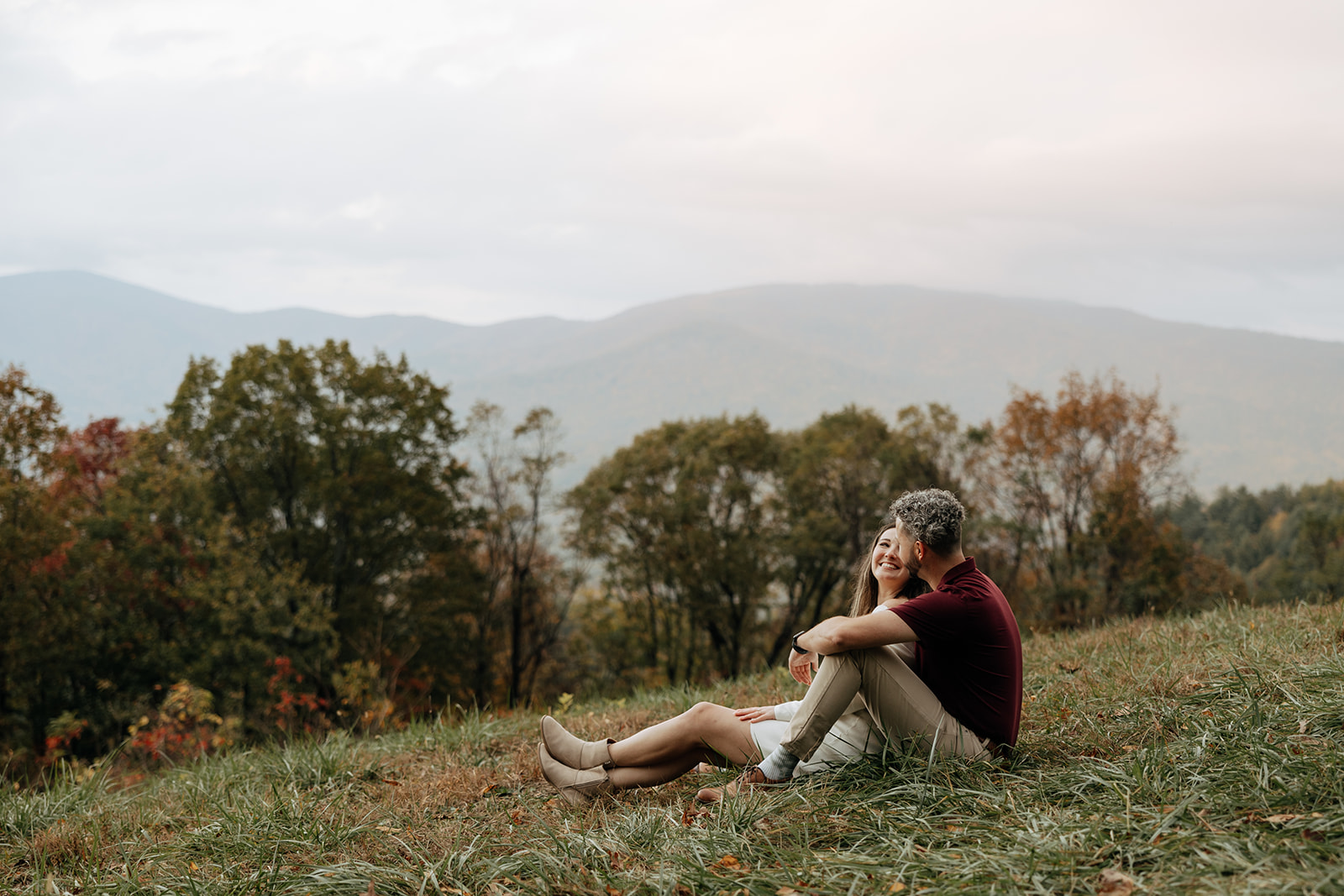 stunning couple pose with Arabia Mountain looming through the fog behind them