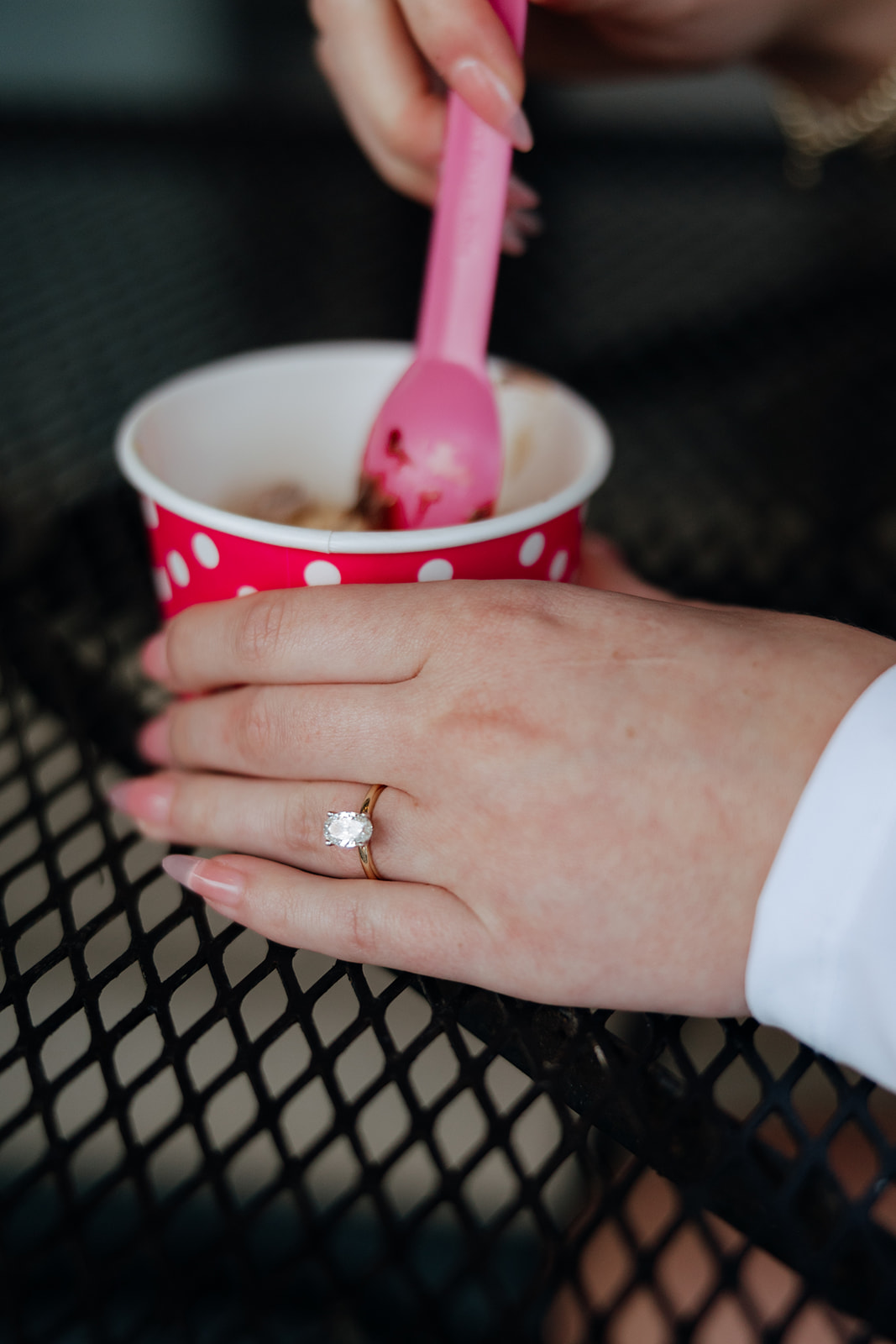 beautiful couple have a fun date at TCBY during their engagement session, sharing fro-yo and laughs