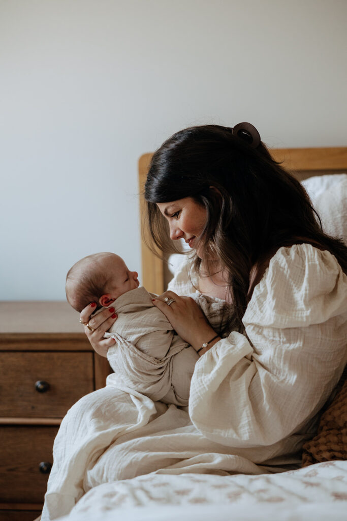 mother holding new baby