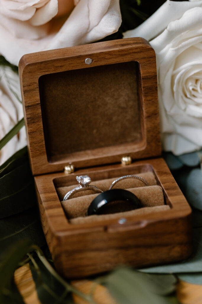 wedding rings in a wooden ring box