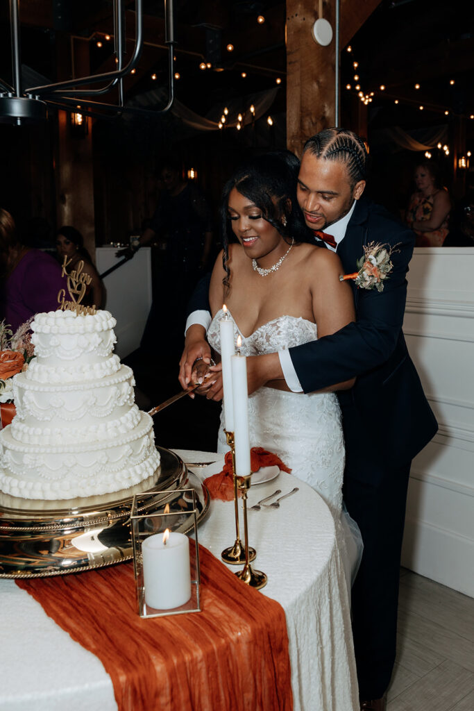 bride and groom cutting their wedding cake