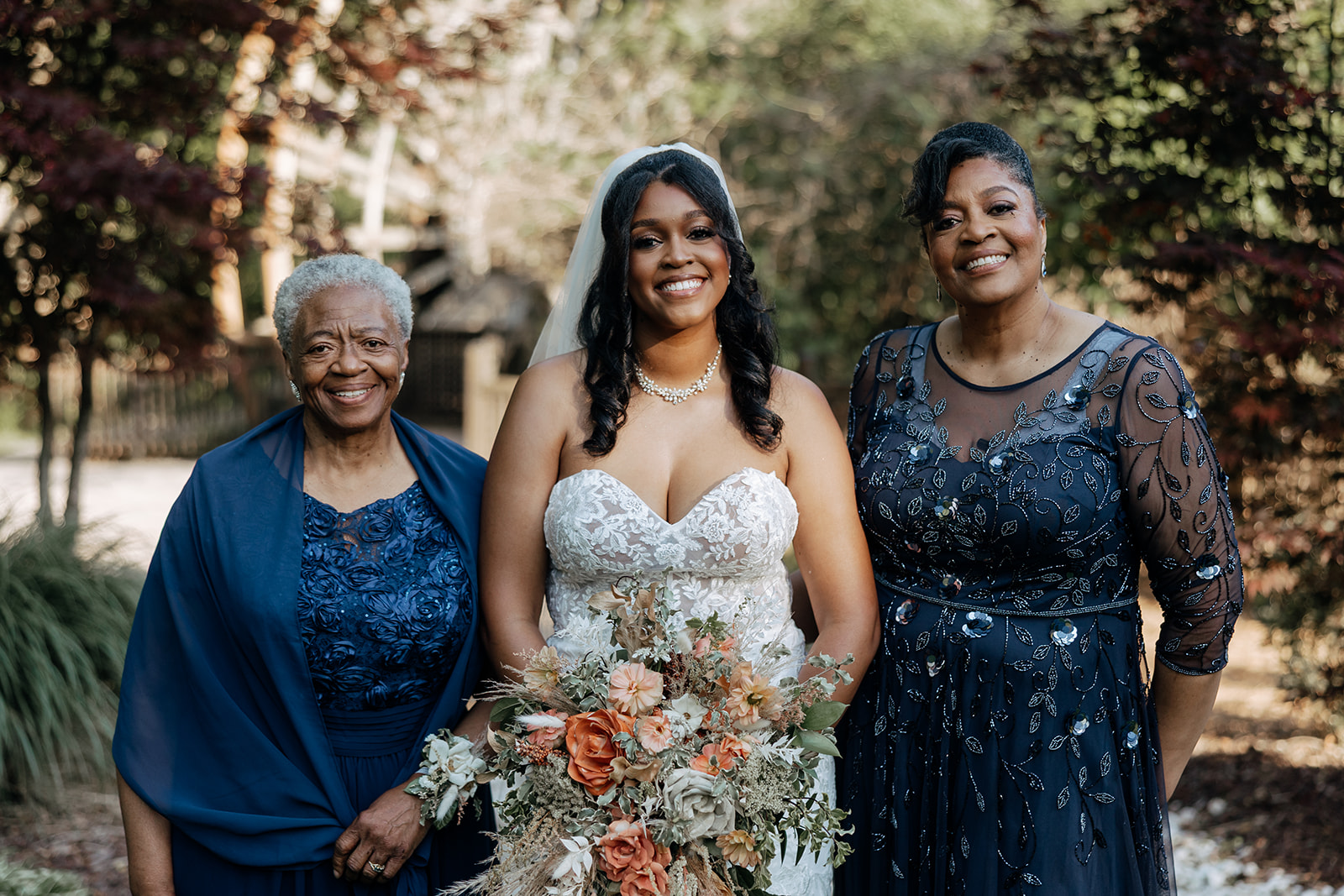 bride with her mother and grandmother on wedding day