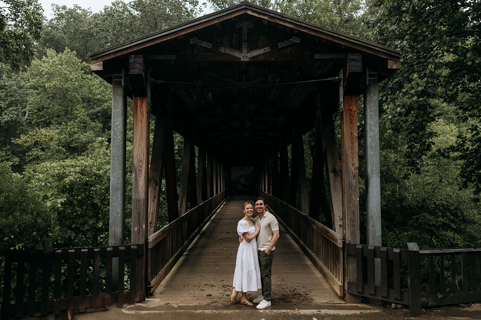 couple at engagement session on a rainy day