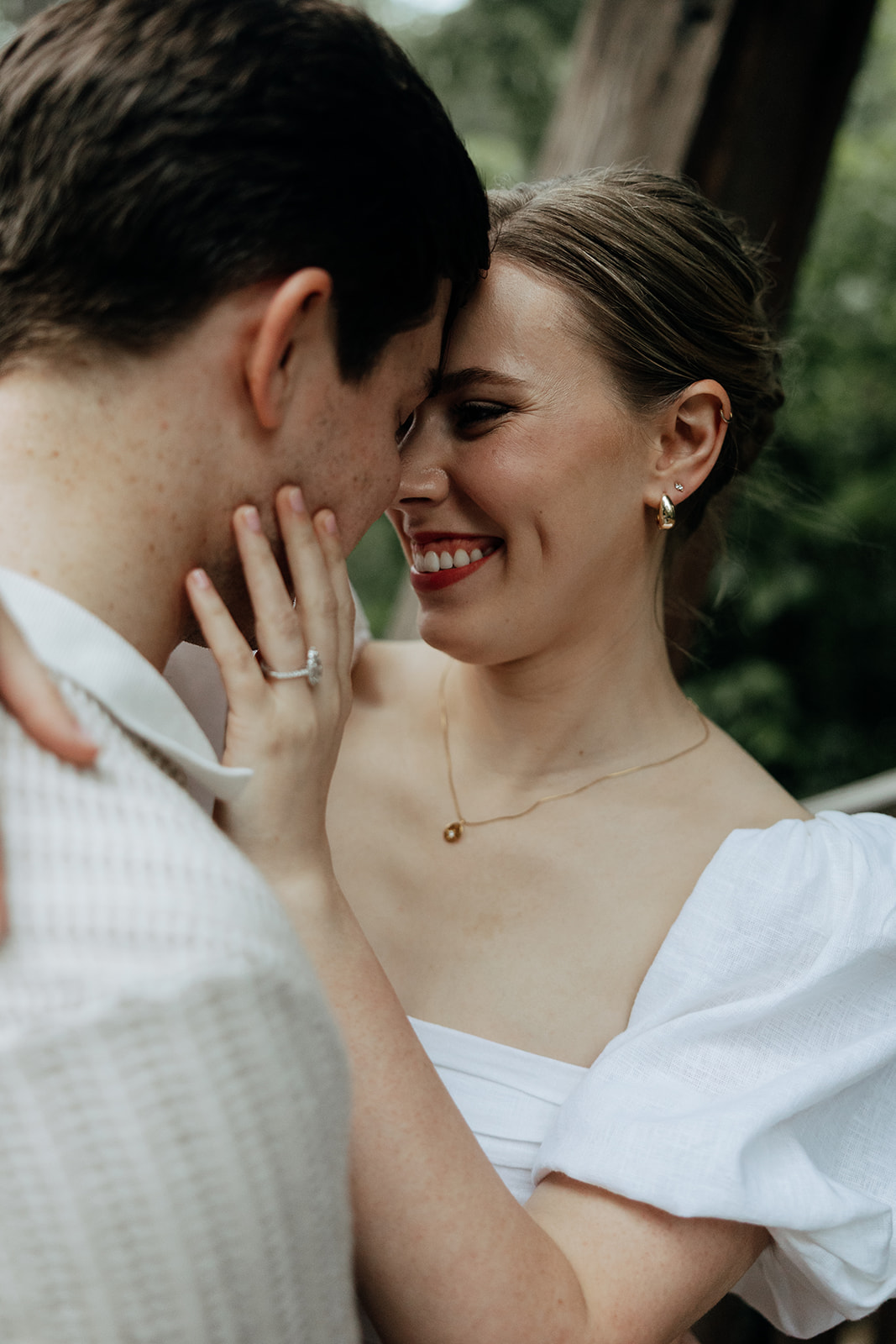 couple at engagement session on a rainy day