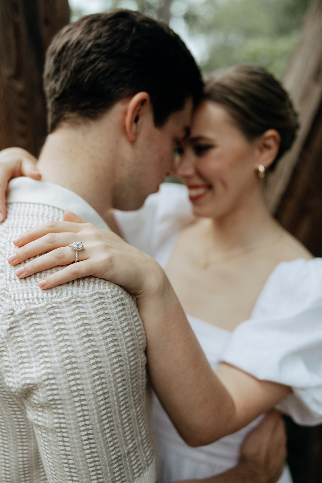 couple at engagement session on a rainy day