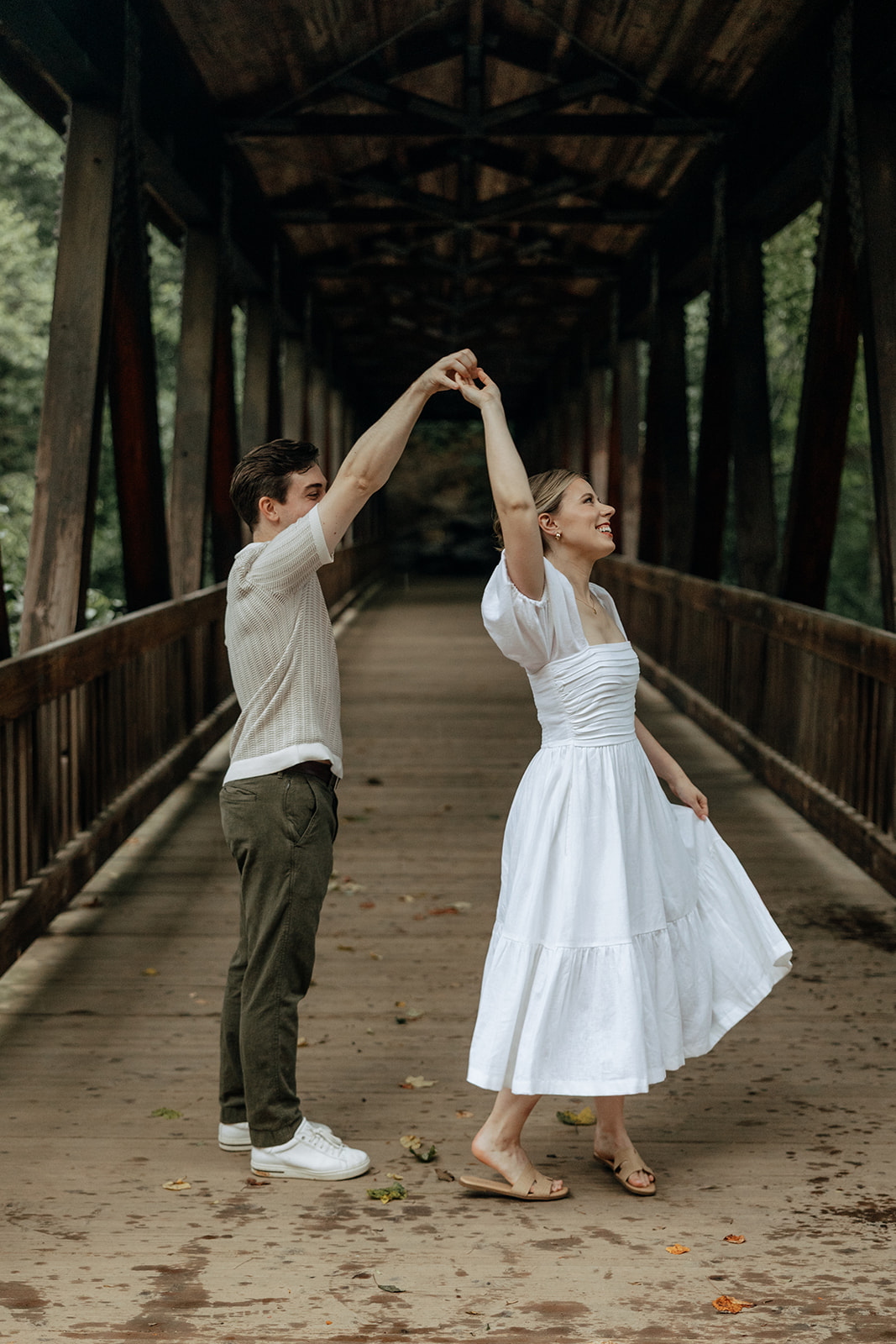 couple at engagement session on a rainy day