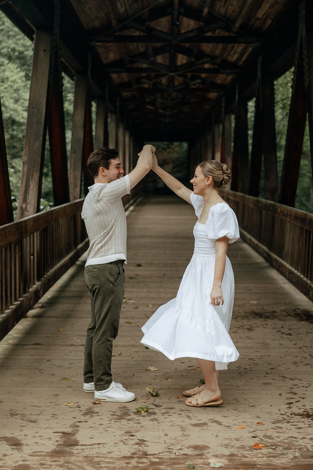 couple at engagement session on a rainy day