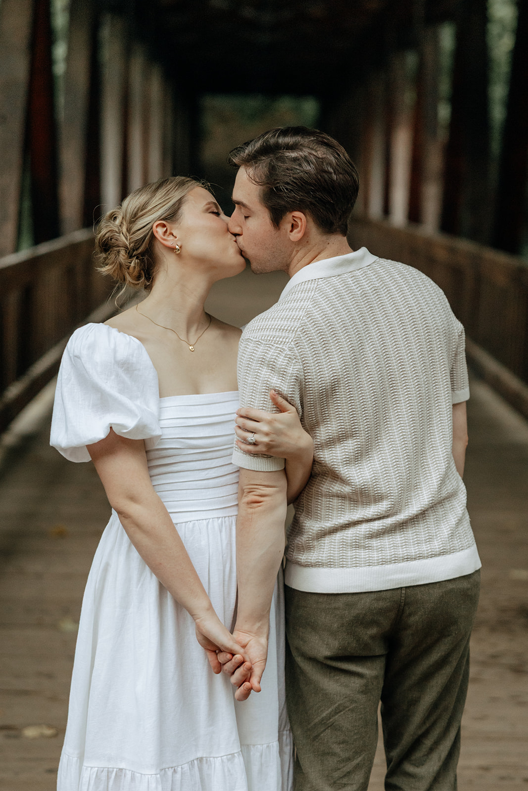 couple at engagement session on a rainy day