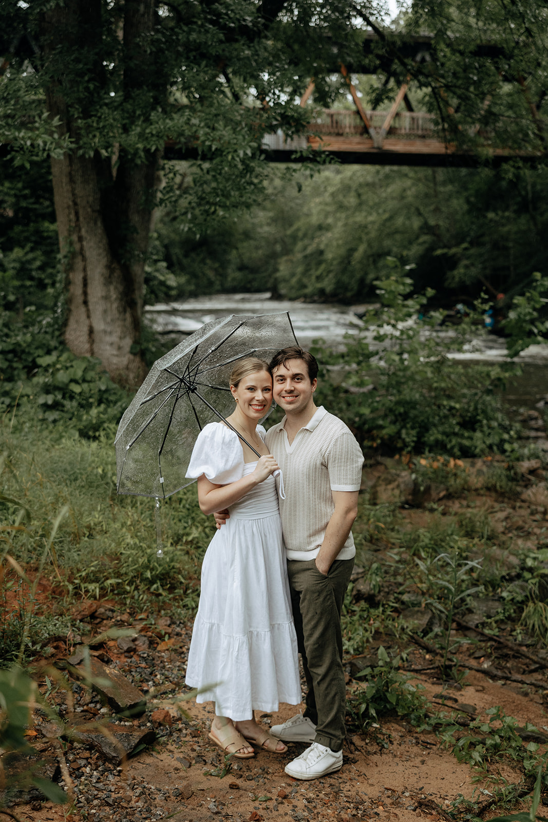 couple at engagement session on a rainy day