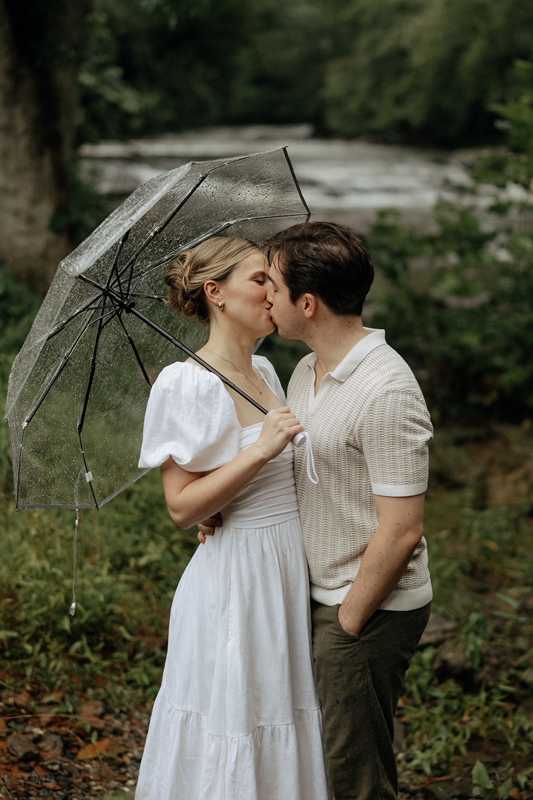 couple at engagement session on a rainy day