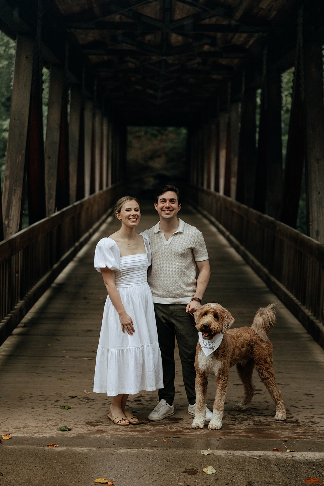 couple at engagement session on a rainy day