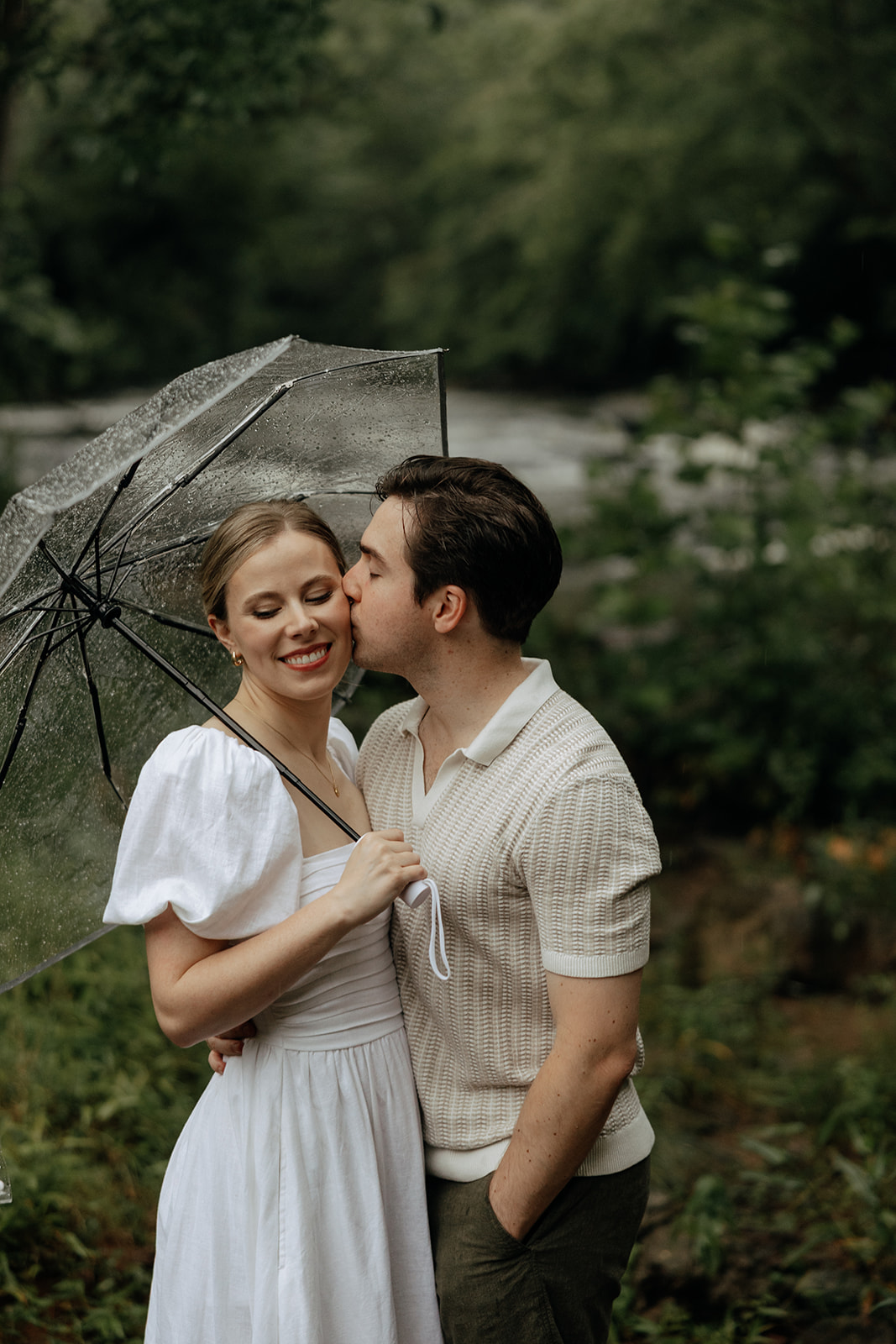 couple at engagement session on a rainy day