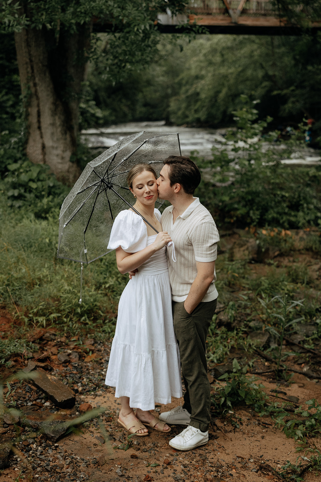 couple at engagement session on a rainy day
