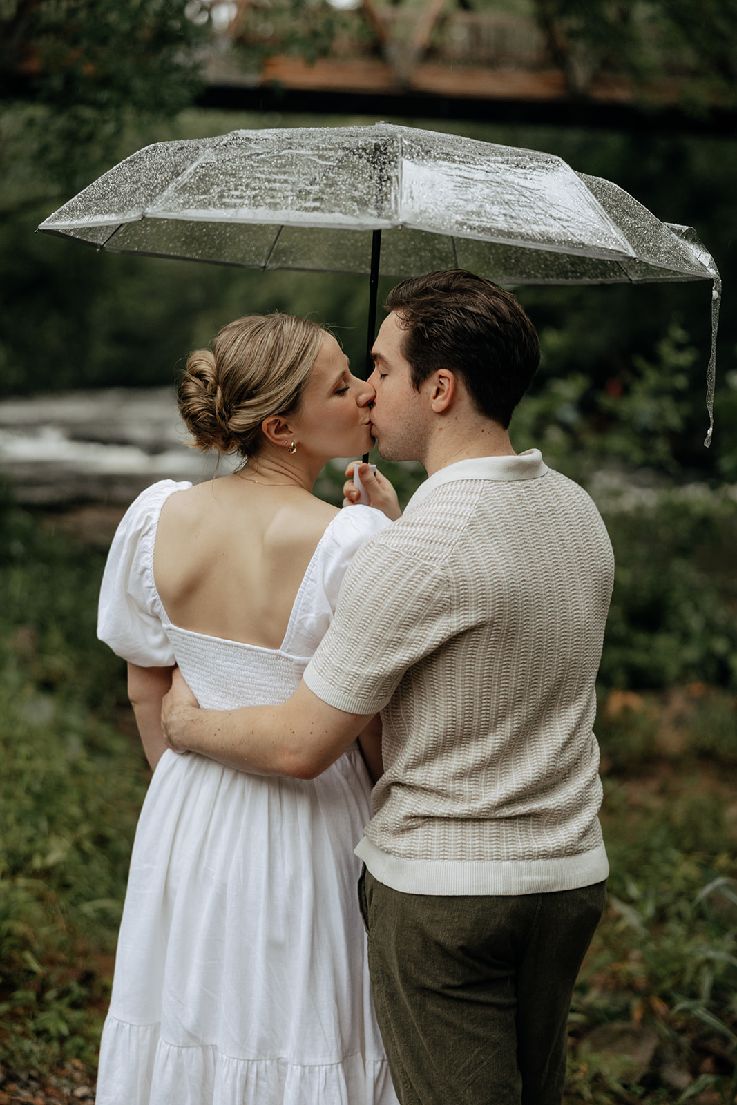 couple at engagement session on a rainy day