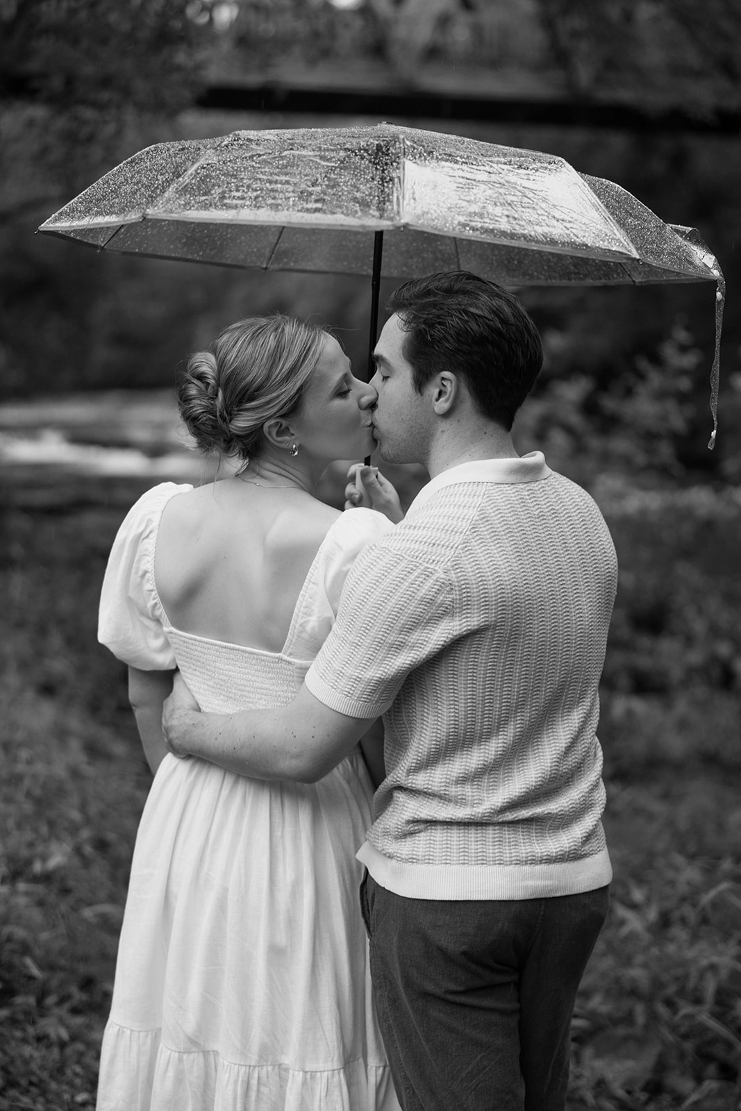 couple at engagement session on a rainy day