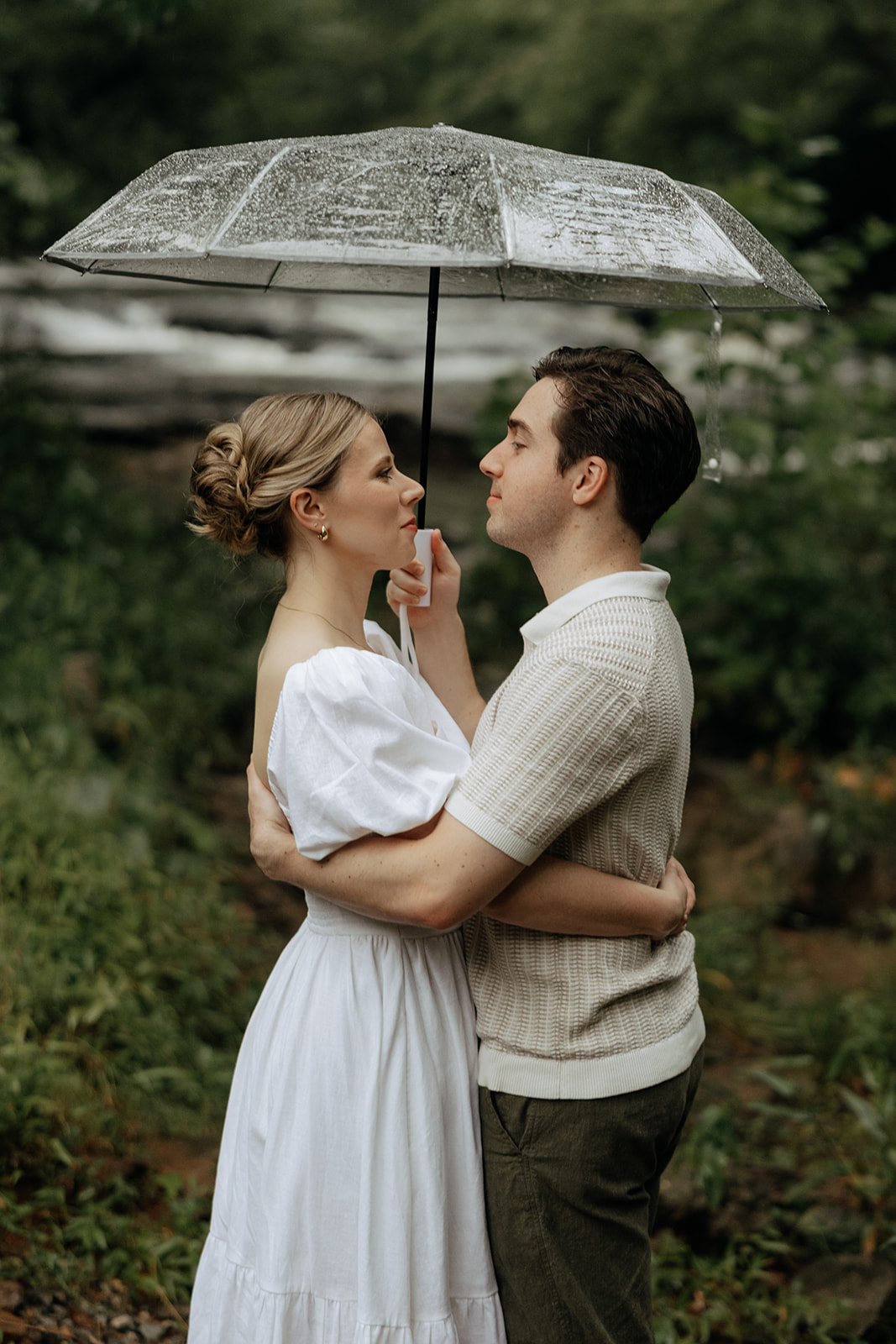 couple at engagement session on a rainy day