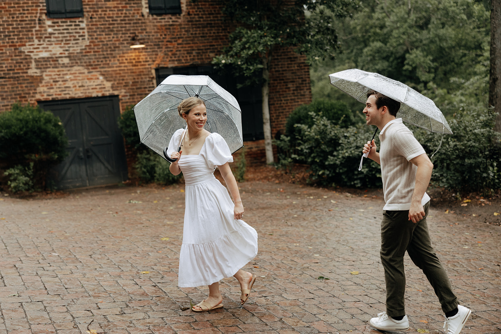 couple at engagement session on a rainy day