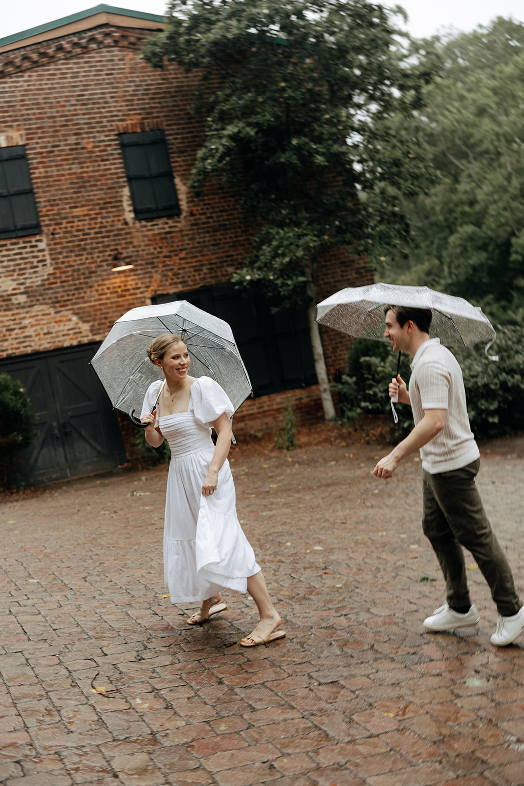 couple at engagement session on a rainy day