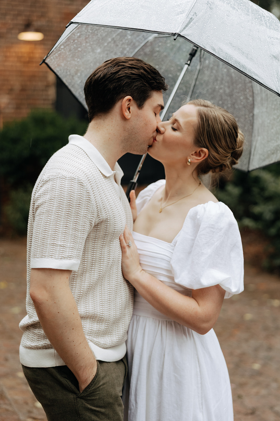 couple at engagement session on a rainy day