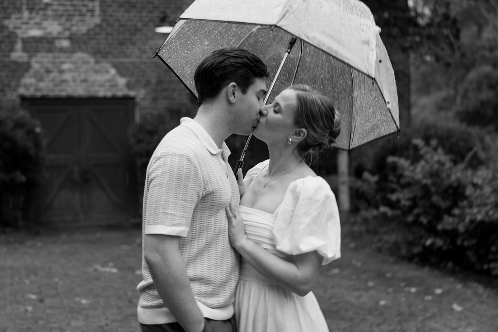 couple at engagement session on a rainy day