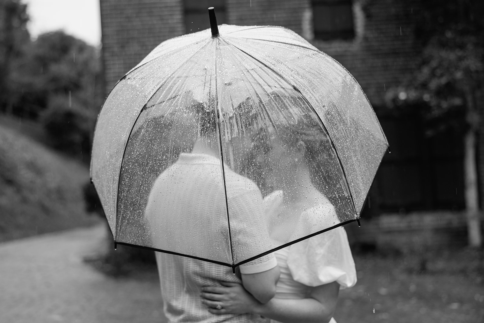 couple at engagement session on a rainy day