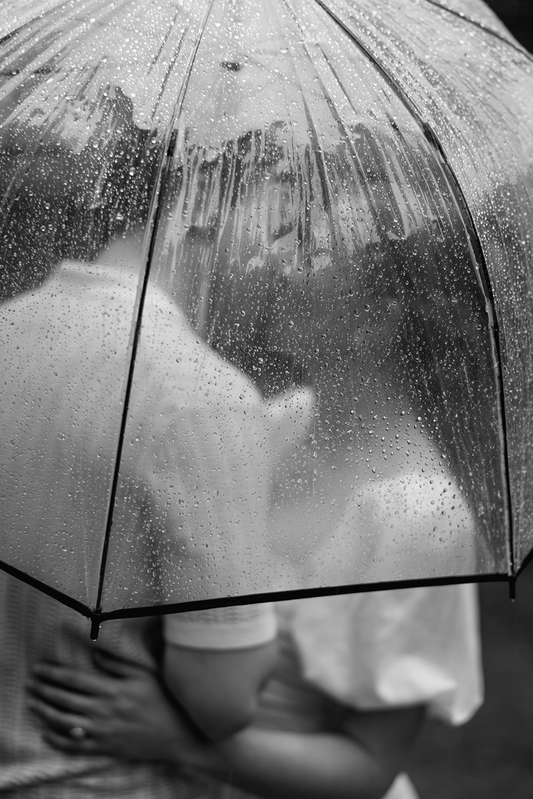 couple at engagement session on a rainy day