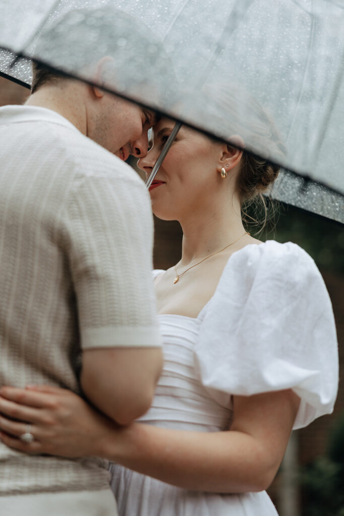 couple at engagement session on a rainy day
