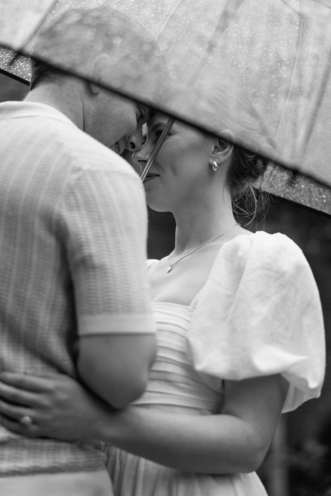 couple at engagement session on a rainy day