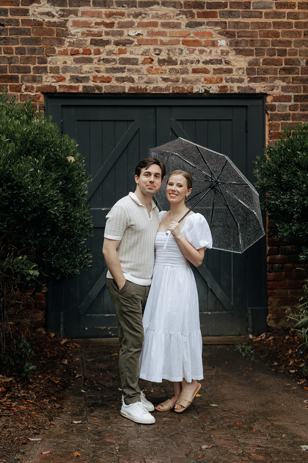couple at engagement session on a rainy day