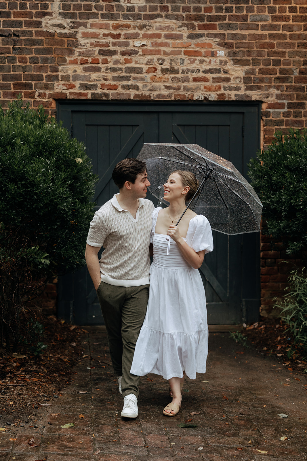 couple at engagement session on a rainy day