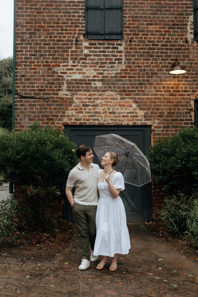 couple at engagement session on a rainy day