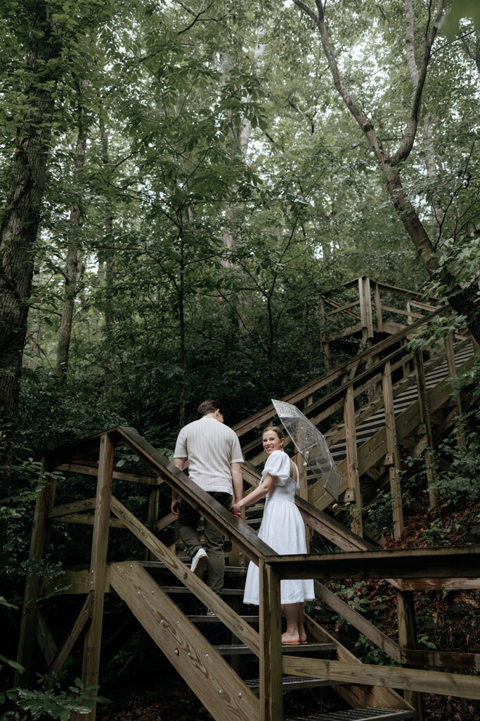 couple at engagement session on a rainy day