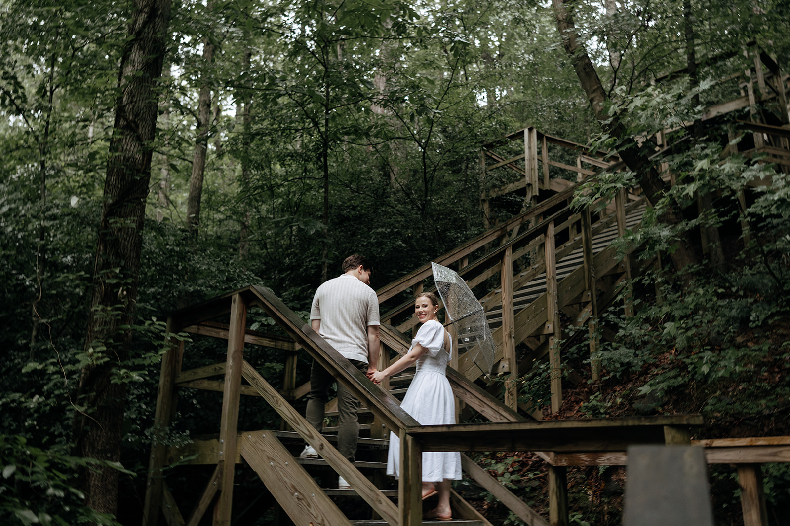 couple at engagement session on a rainy day
