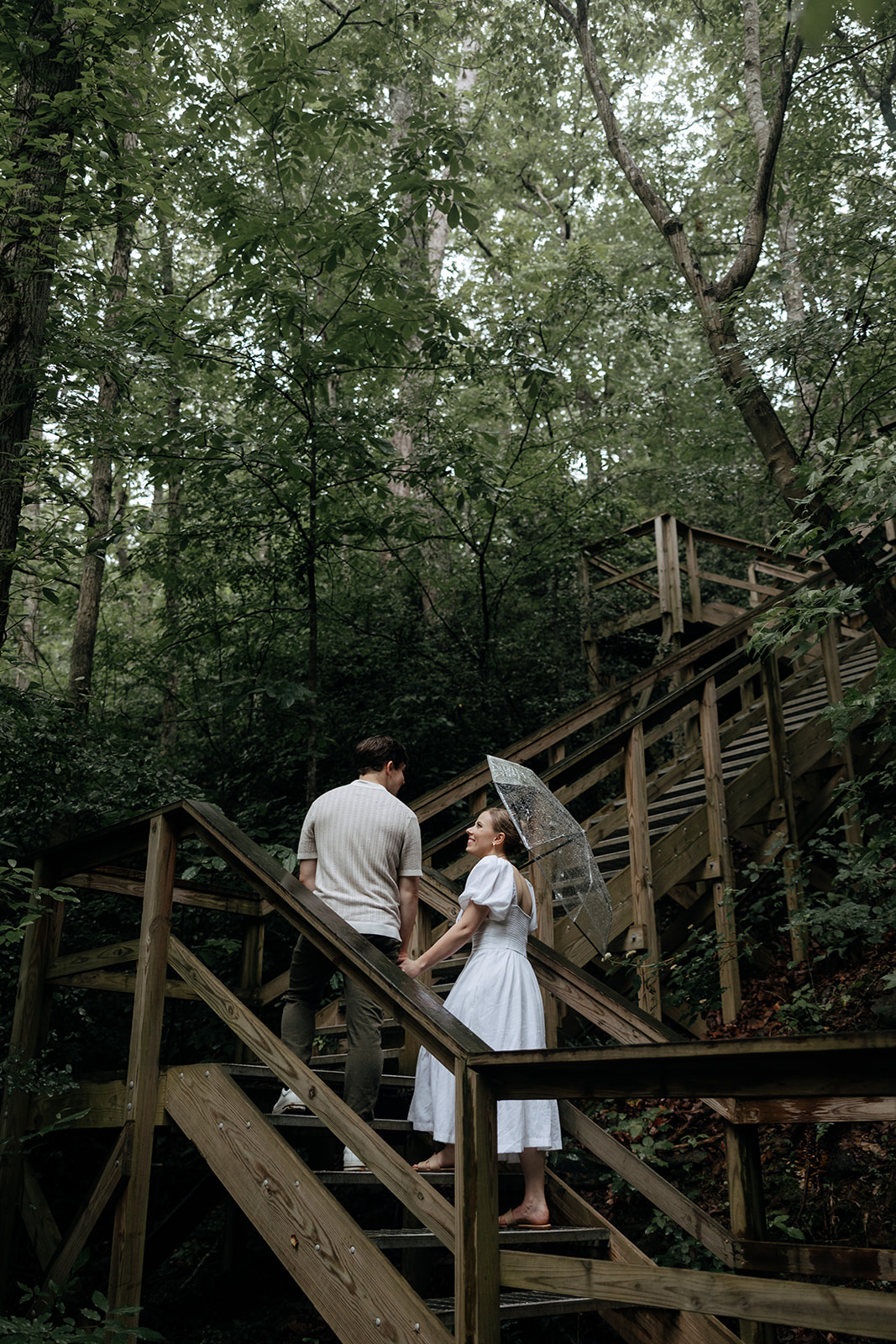 couple at engagement session on a rainy day