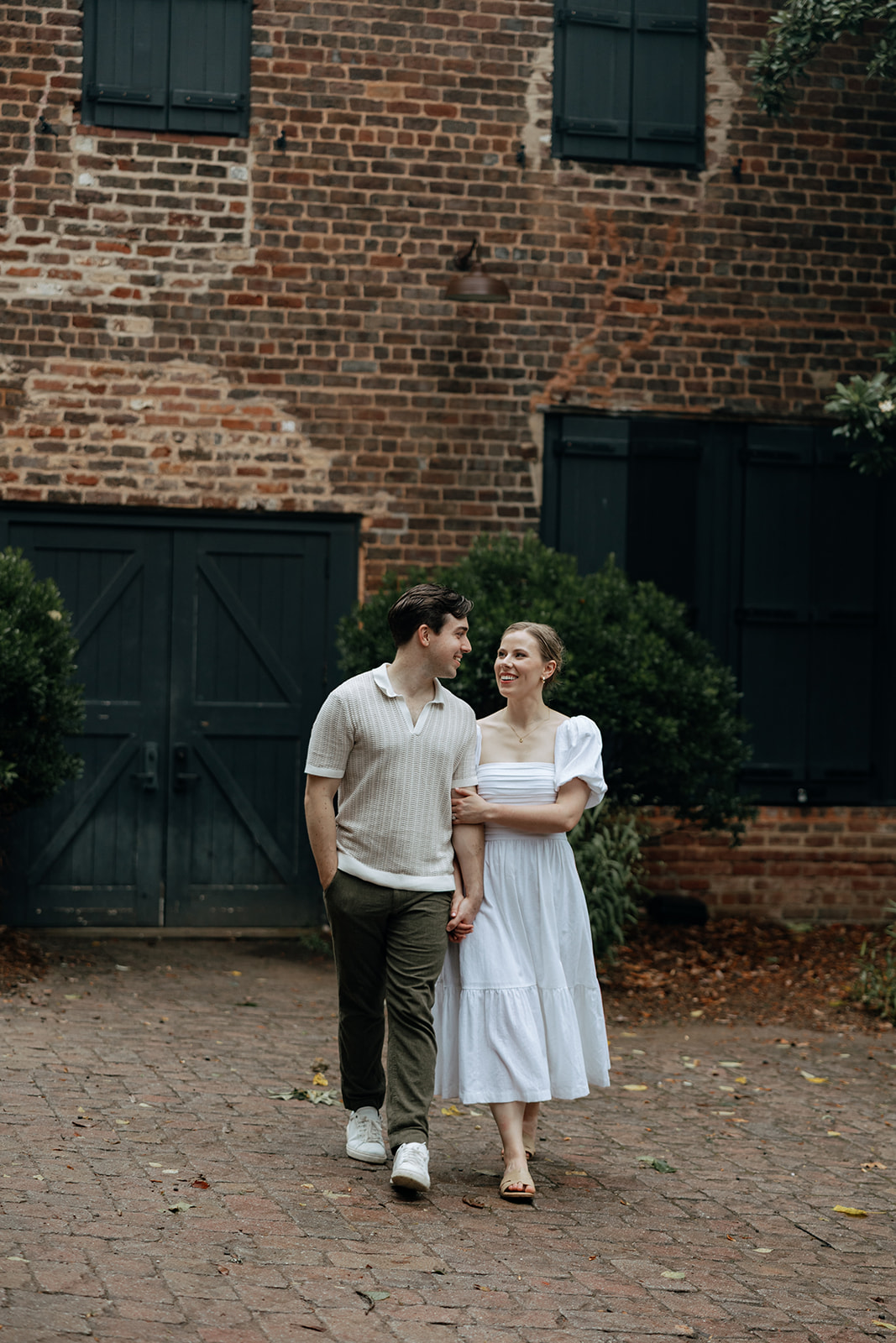 couple at engagement session on a rainy day