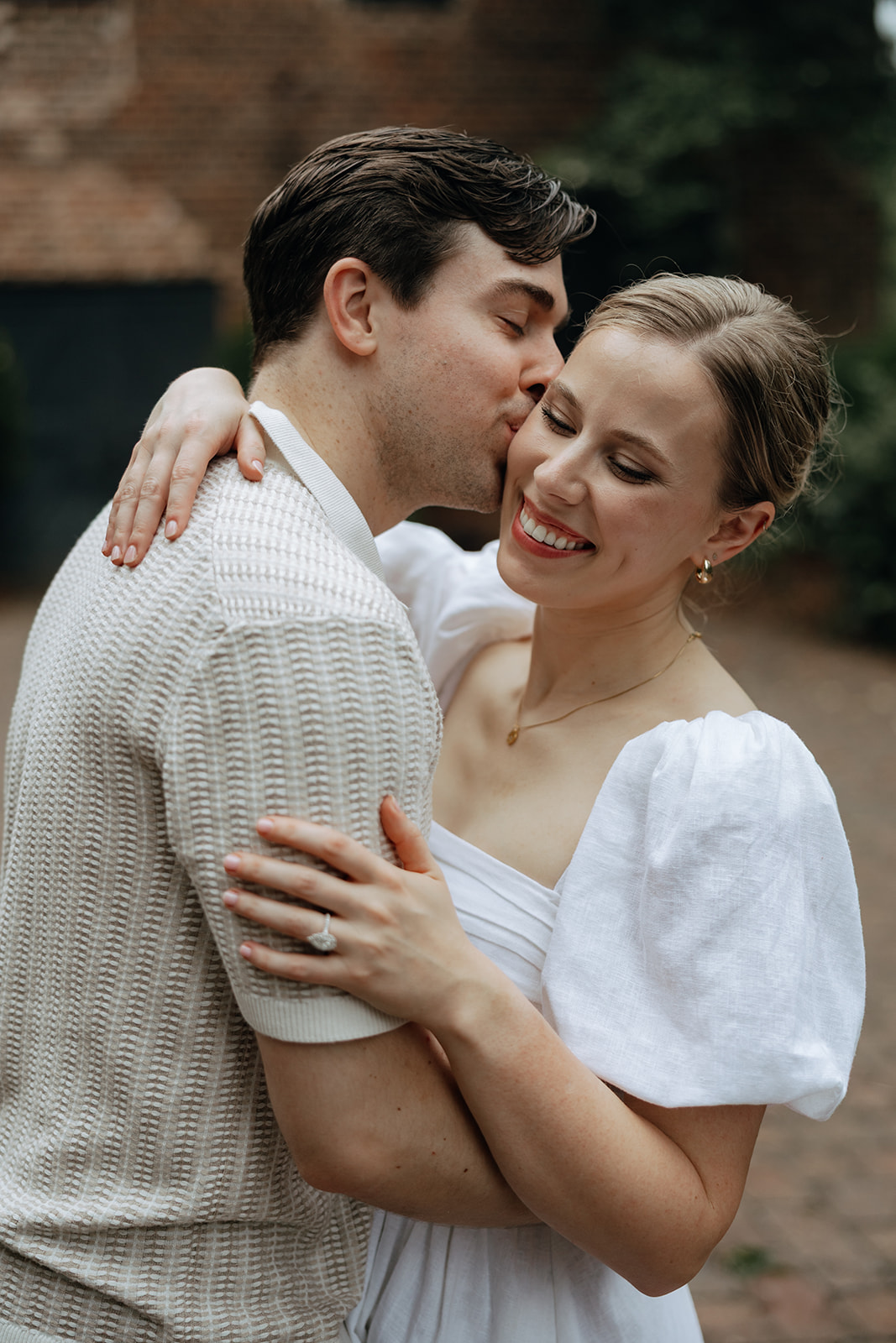 couple at engagement session on a rainy day