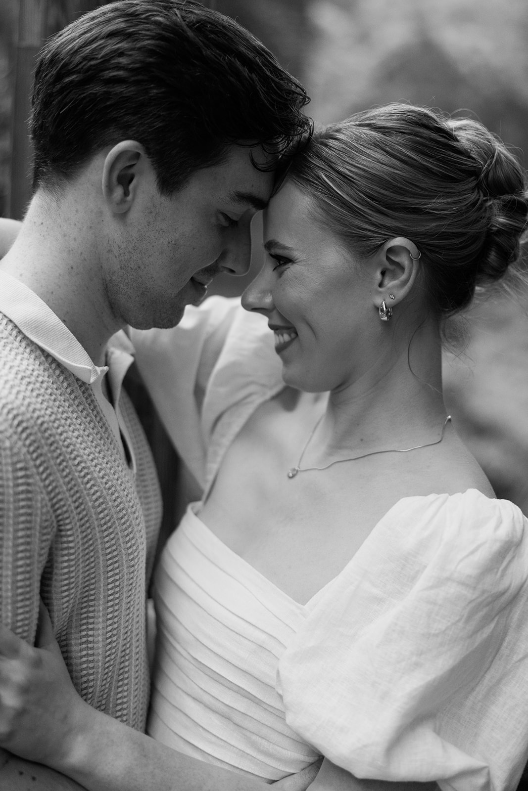 couple at engagement session on a rainy day