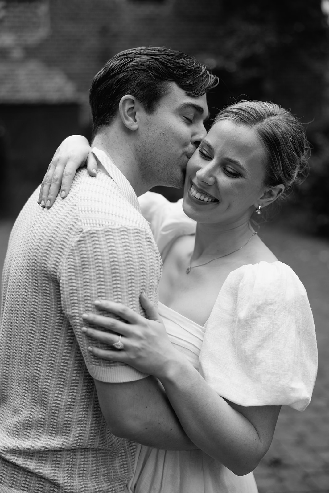 couple at engagement session on a rainy day