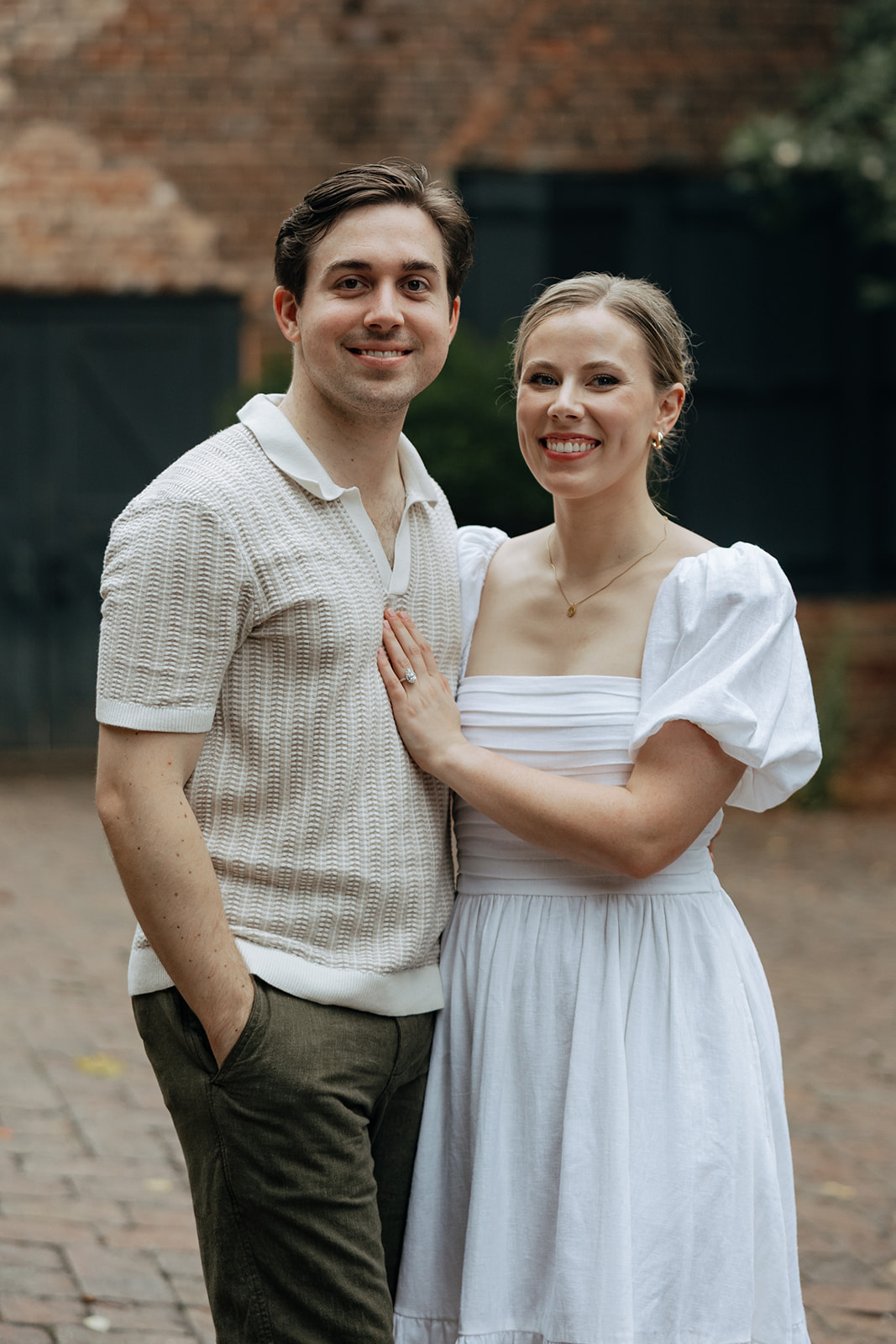 couple at engagement session on a rainy day