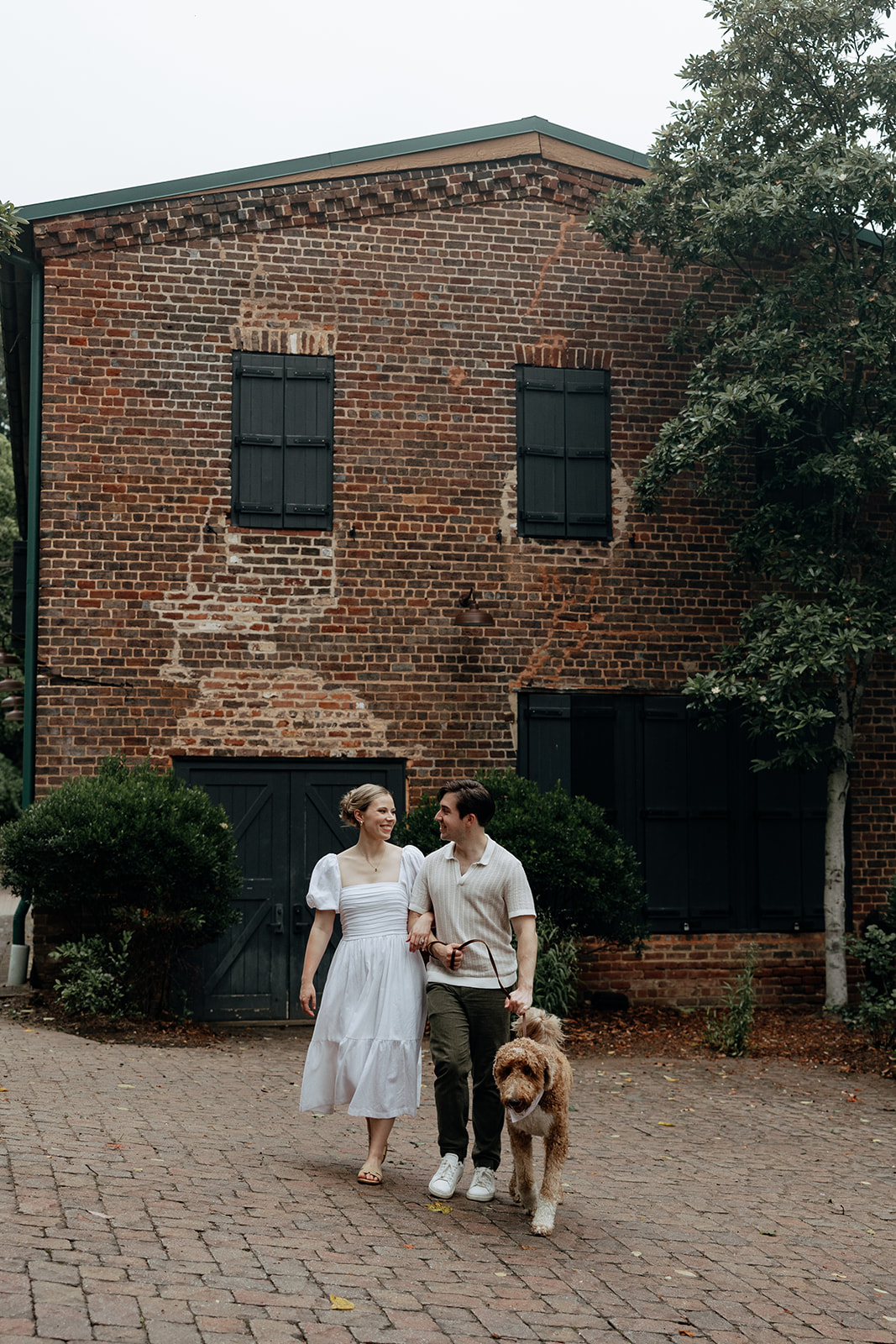 couple at engagement session on a rainy day